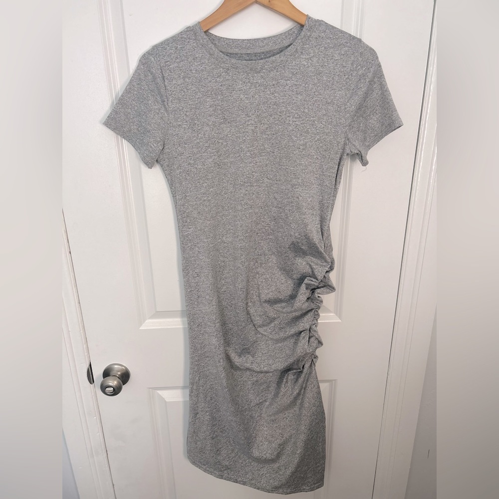 Brand new, M body-con dress, ruching on side, hits above the knee.
